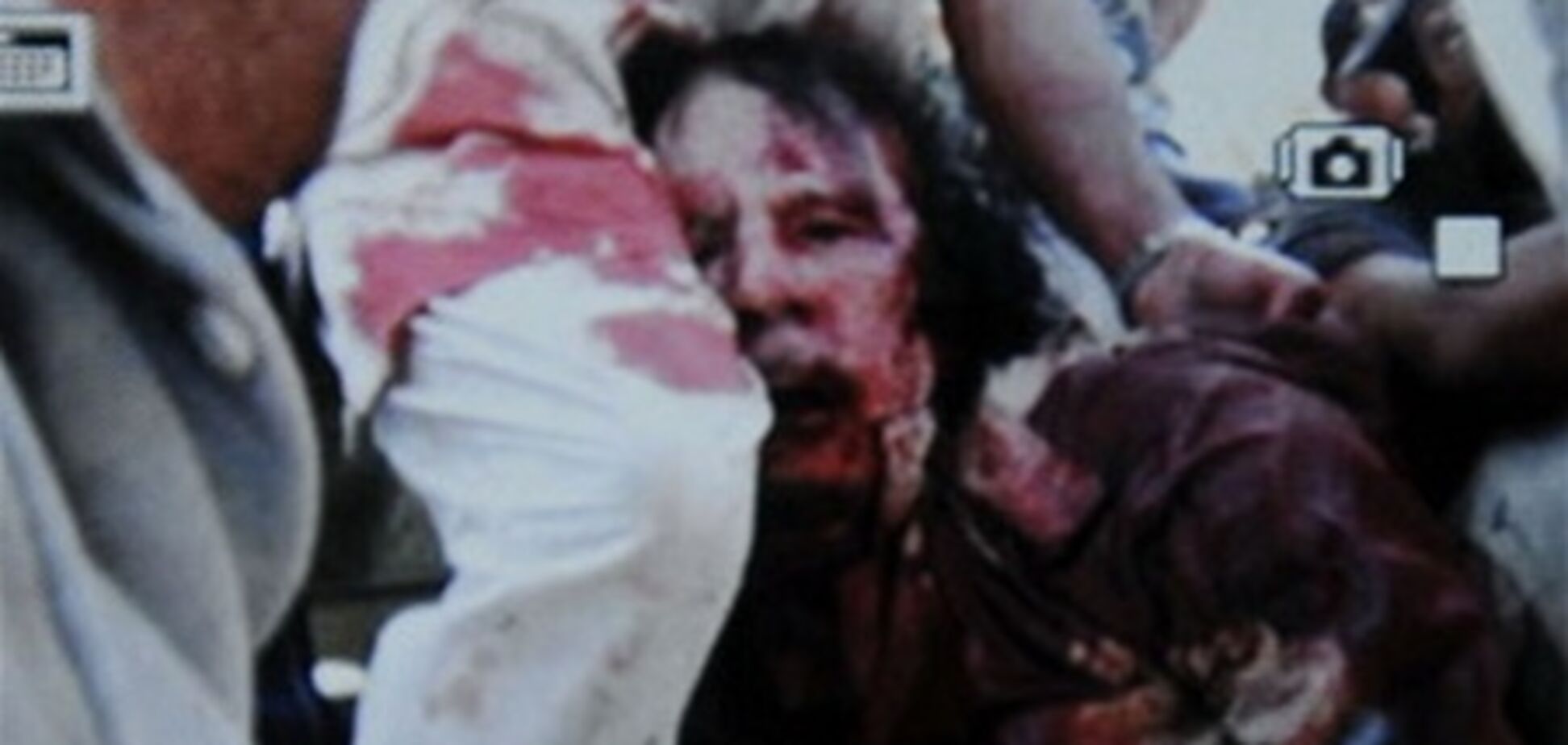 Обнародованы фотографии убитого Муаммара Каддафи