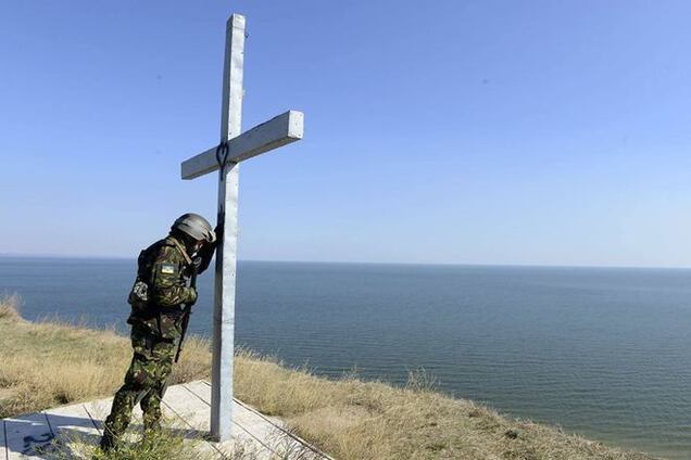 Фотография 'Украинский солдат в молитве' облетела мир
