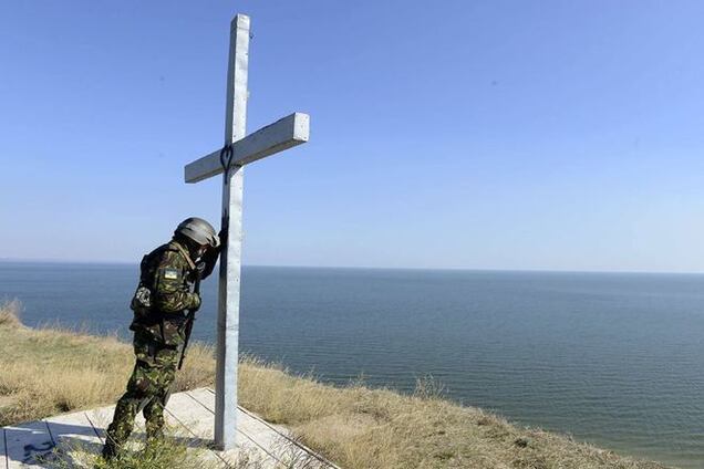 Фотографія 'Український солдат в молитві' облетіла світ