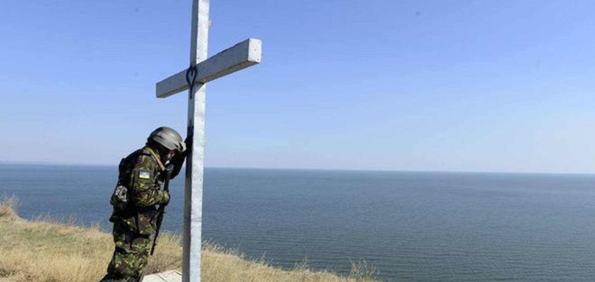 Фотографія 'Український солдат в молитві' облетіла світ