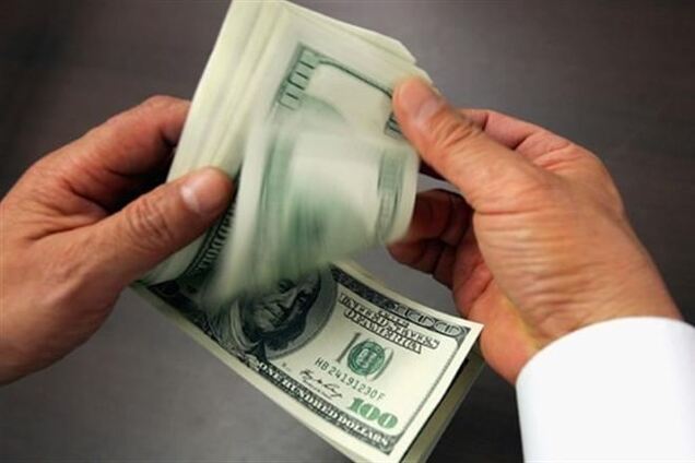 Гривня укрепляется: официальный курс доллара 9,69 