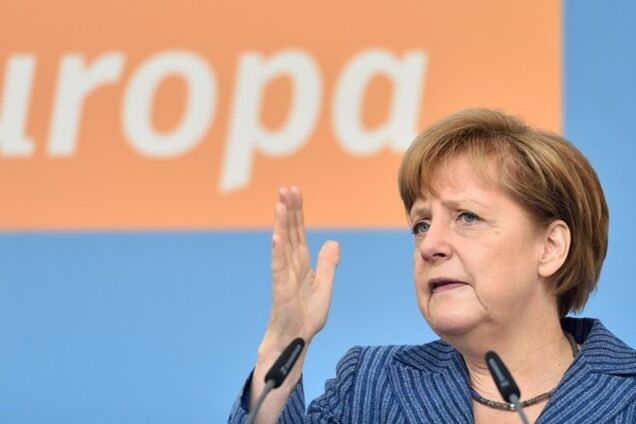 Путин должен сотрудничать с новоизбранным Президентом Украины - Меркель