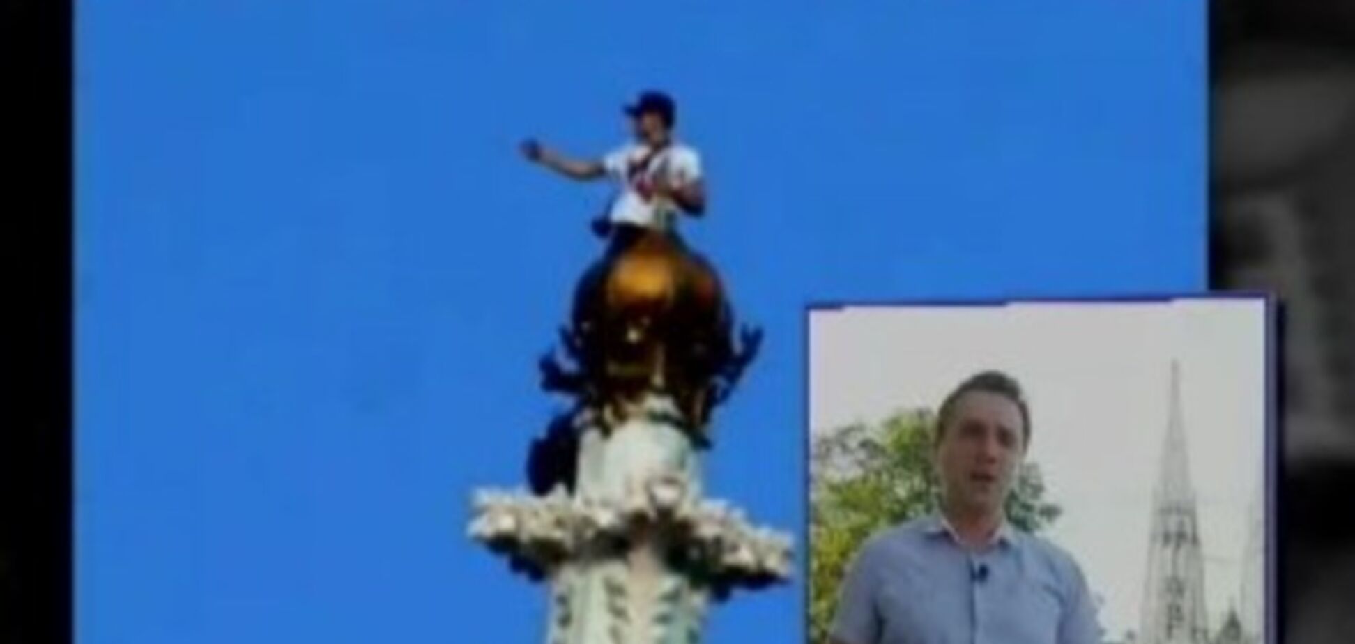 Киевлянин с трезубцем без страховки взобрался на 99-метровую церковь в Австрии