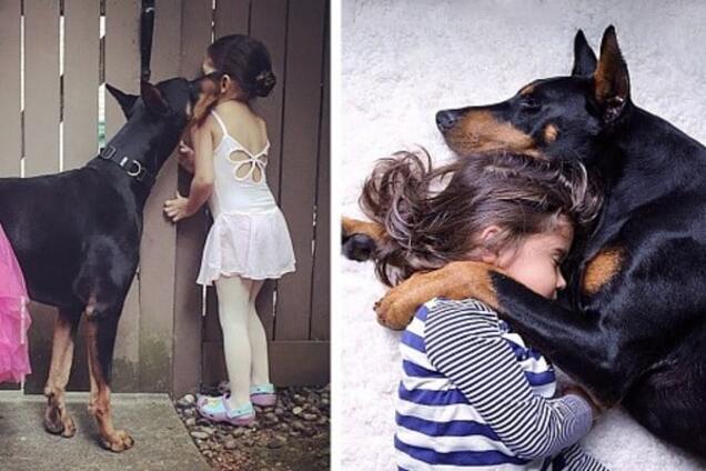 Малышка и доберман: сеть покорили трогательные фото настоящих друзей