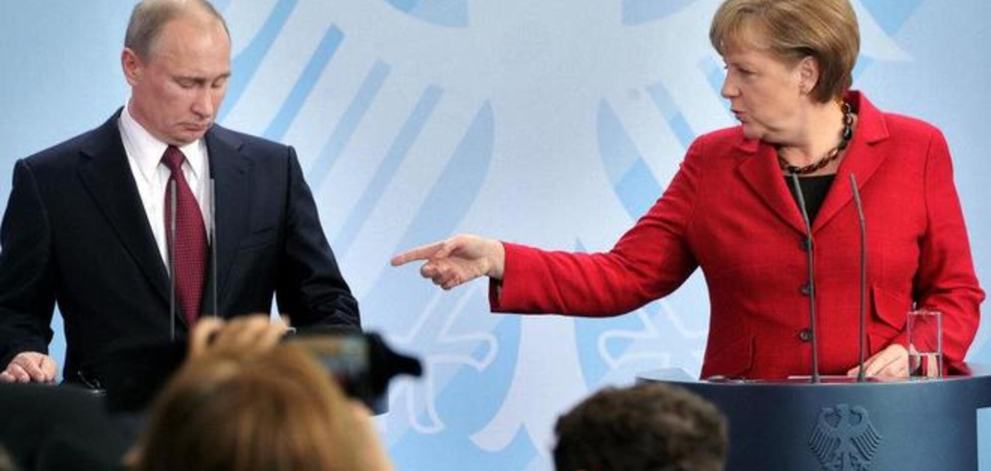 Меркель потребовала от Путина начать отвод российской тяжелой техники из Украины