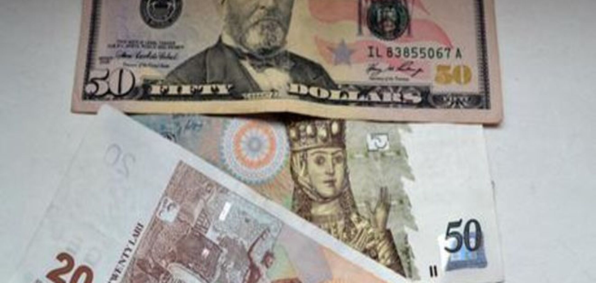 Отход от либерального курса ударил по грузинской валюте