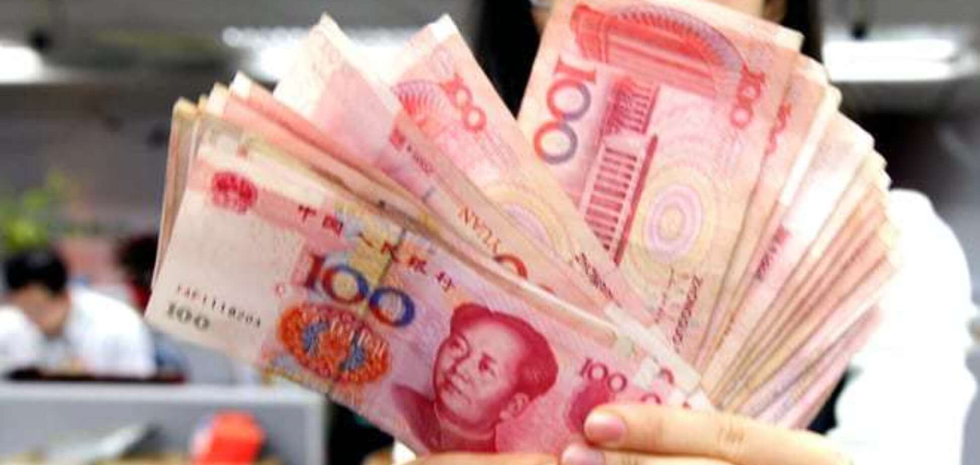 Китай снова девальвировал юань