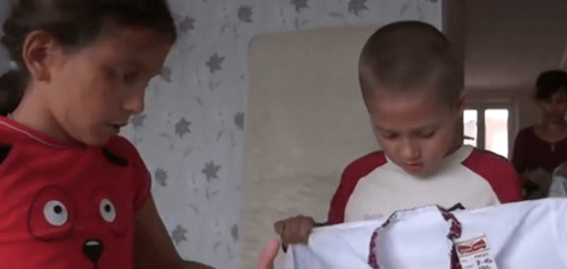 Дети комбата Юлдашева отправились в Австрию в вышиванках: видеофакт