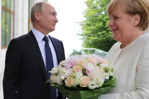 Путін і Меркель