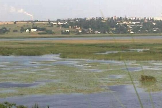 В Буге нашли труп женщины с камнем на поясе