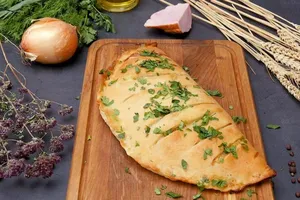 Кальцоне з шинкою і сметаною - покроковий рецепт Кальцоне з шинкою і сметаною - покроковий рецепт