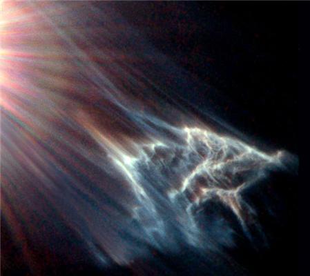 На изображении NASA показал звездный свет, который медленно поглощает блуждающее облако газа и пыли