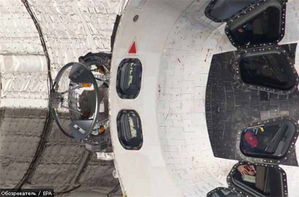 Астронавты Discovery приступили к работе в открытом космосе