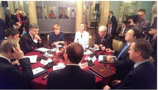 Тільки Путіну знадобилися навушники для синхронного перекладу на сніданку в Мілані: опубліковано фото