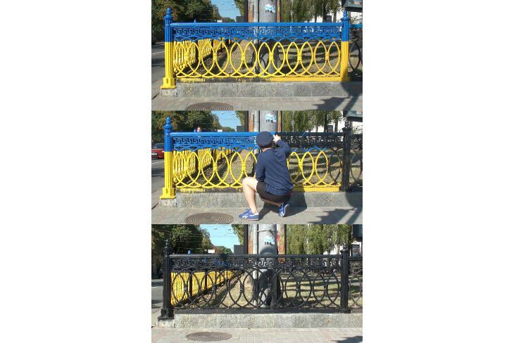 Возмущенный киевлянин перекрасил сине-желтый забор в центре столицы в черный цвет