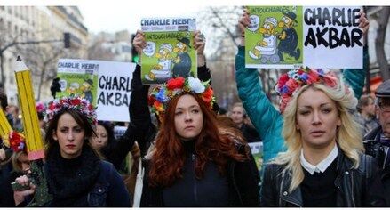 Charlie Akbar! Femen с карандашами-автоматами вышли на Марш единства в Париже: фотофакт