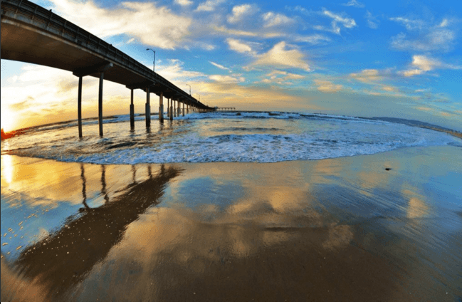 Фотограф Джим Грант запечатлел радугу на волнах: потрясающие фото с пляжа
