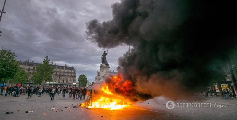 Водометы и газ: многотысячные протесты в Париже переросли в кровавые драки с полицией. Фоторепортаж