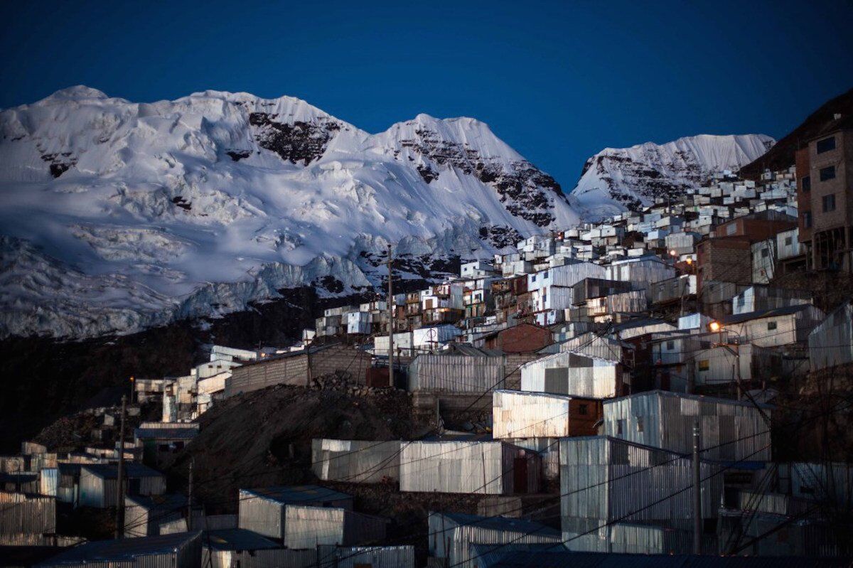 The settlement has been built at an astonishing height of 16,700 feet and lies in the shadow of Bella Durmiente — or Sleeping Beauty — an enormous glacier that lurks over the town.
