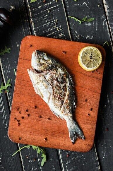 Тушеная рыба с овощами