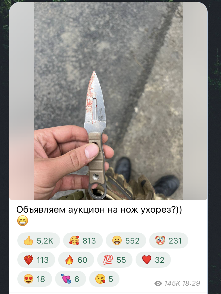 Денацифікація? Російський силовик, який затримував нібито терориста з "Крокуса", засвітив на рукаві неонацистський символ. Фото
