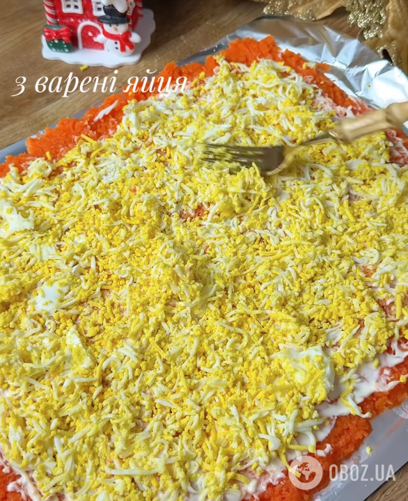 "Мімоза" в рулеті для новорічного столу: найпростіший рецепт ситної страви