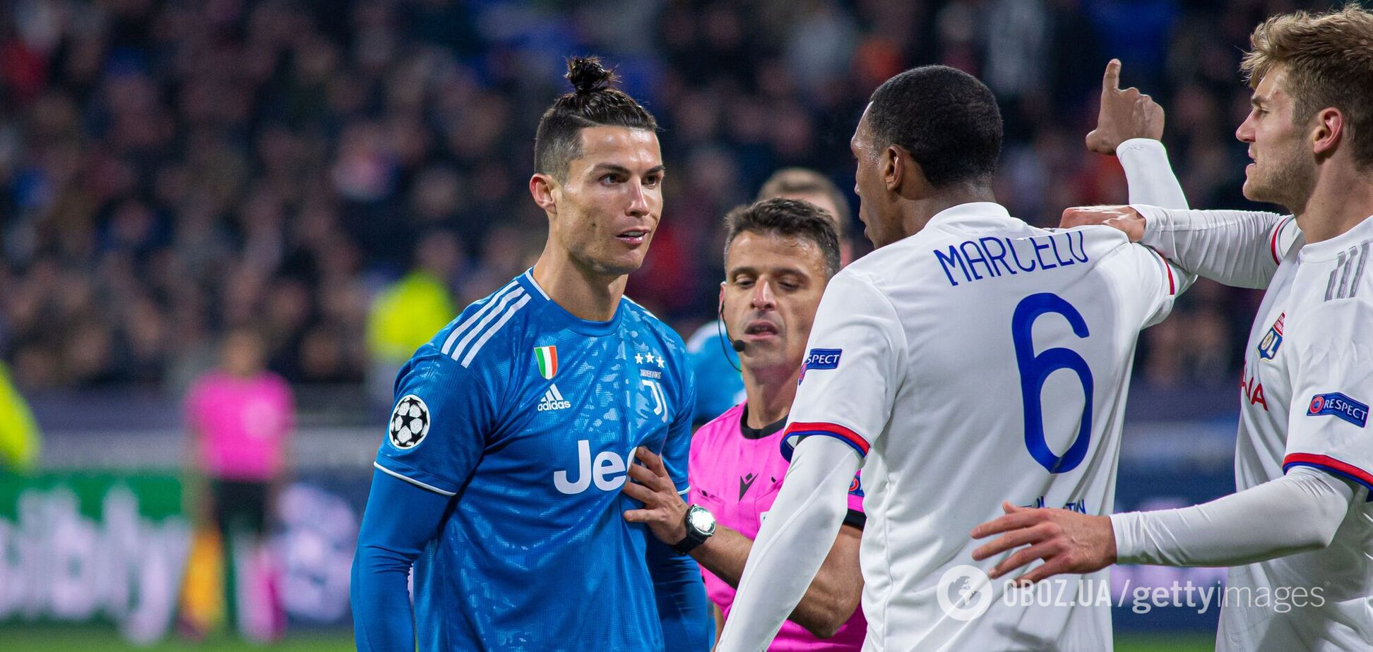 Игрок 'Лиона' Марсело спорит с Криштиану Роналду