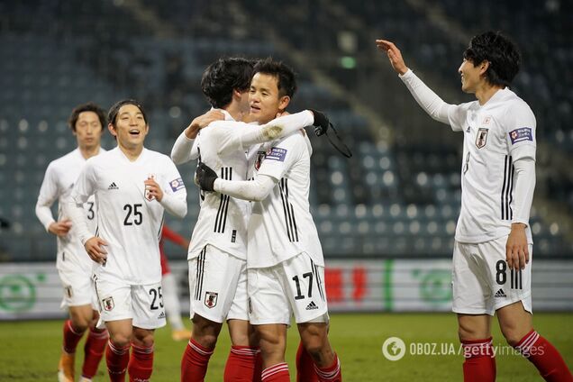 Игроки сборной Японии празднуют гол