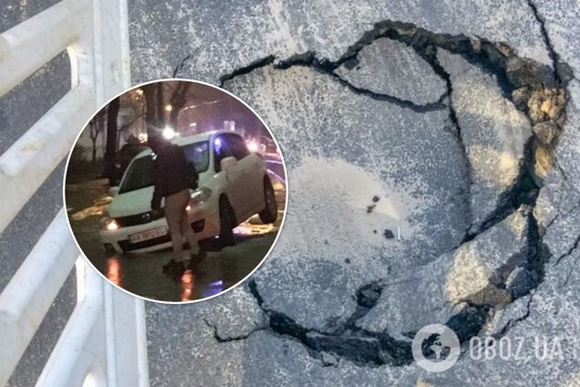 В Киеве из-за прорыва трубы легковушки провалились под асфальт. Фото и видео