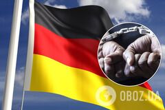 Прапор Німеччини та руки в наручниках