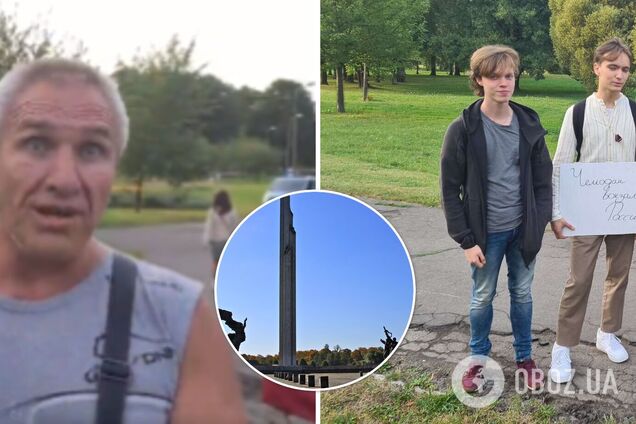 'Ты еще украинский флаг разверни!' В Латвии россиянин устроил истерику из-за плаката 'Чемодан – вокзал – Россия'