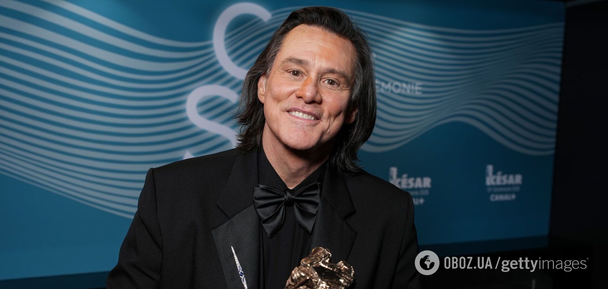 Изменился до неузнаваемости: какую теорию заговора приписывают Джиму Керри после появления на церемонии награждения премии 'Сезар'