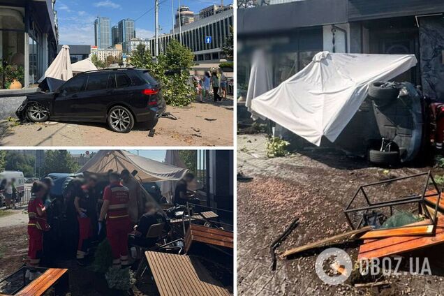 В центре Киева две машины BMW после ДТП вылетели на тротуар и снесли летнюю террасу ресторана. Фото и видео
